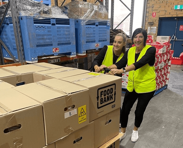 Pushing boxes at Foodbank SA