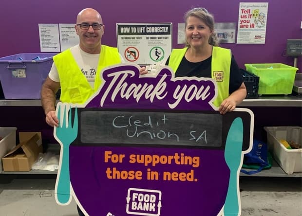 Credit Union SA employees holding Thank you sign